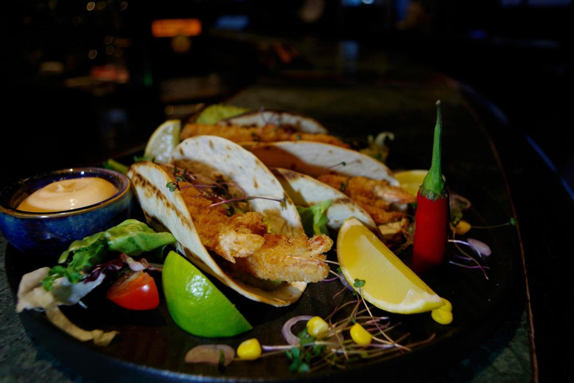 Sheraton Poznan Hotel Luaran gambar A plate of grilled mussels